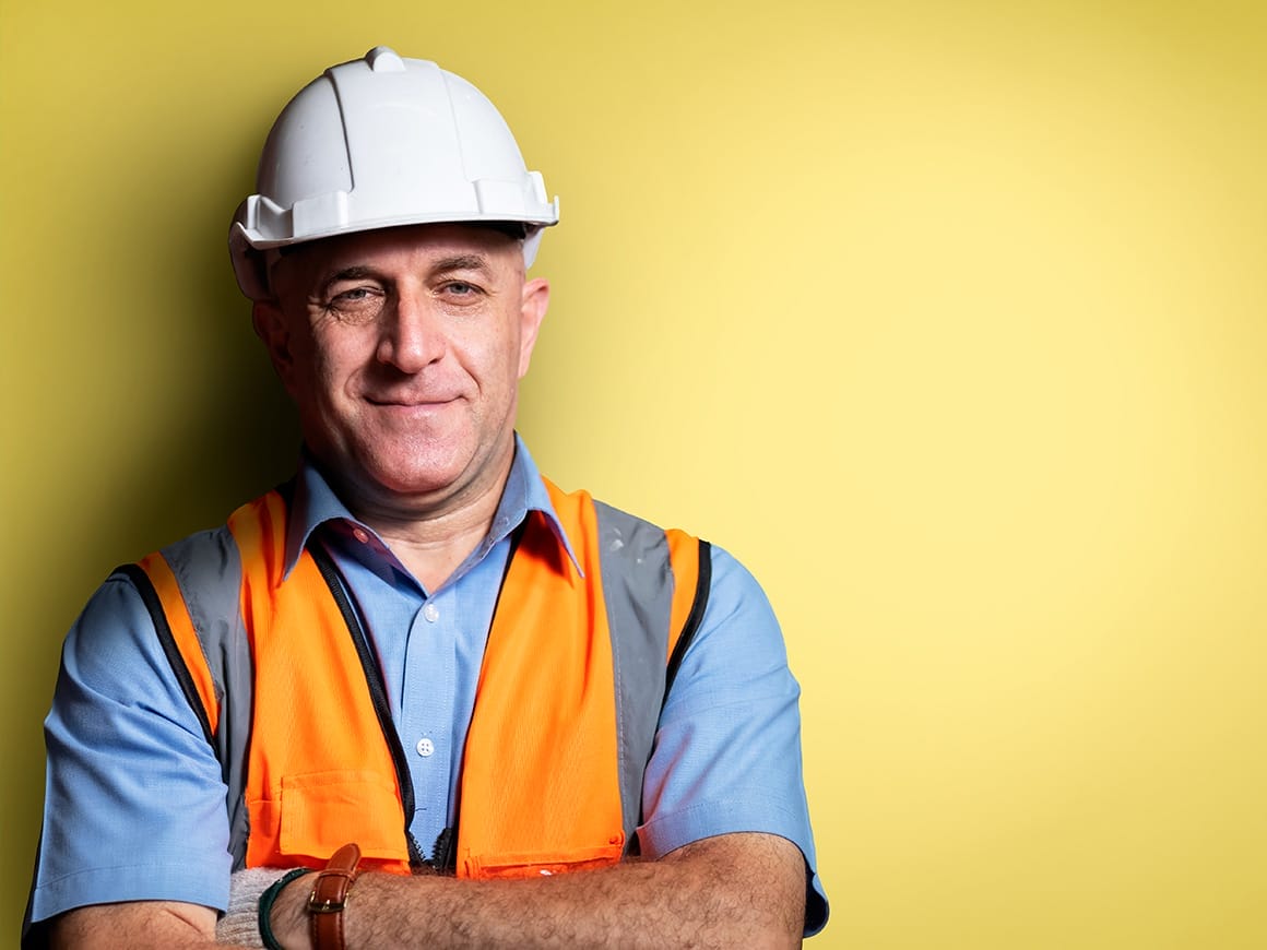 man wearing a safety vest and a hardhat